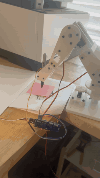 Scribbot drawing a star on a sticky note